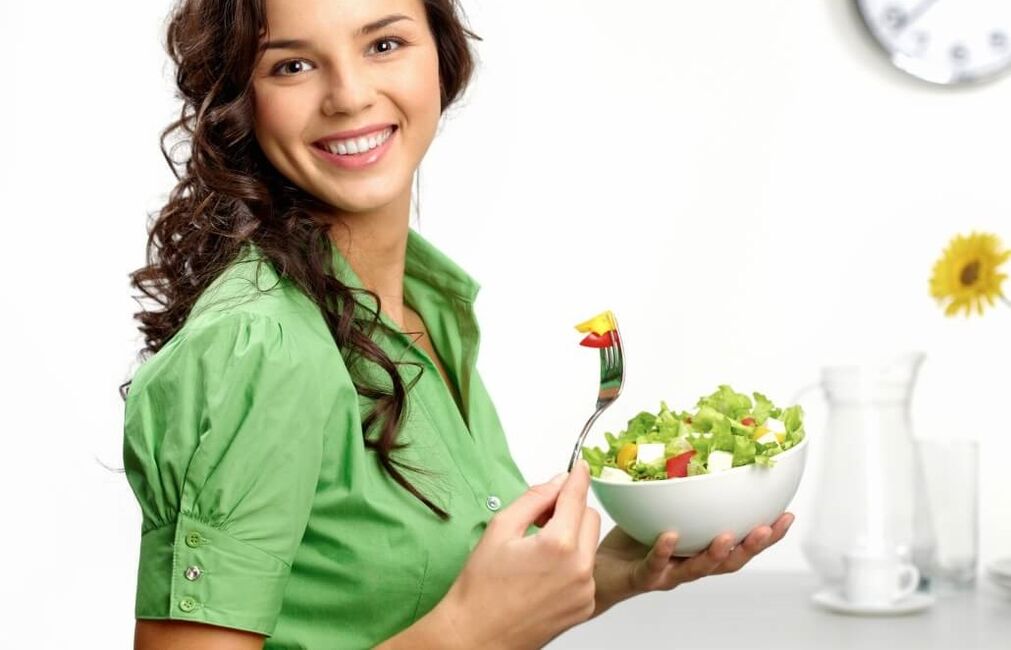 girl eating vegetable salad on a 6-petal diet