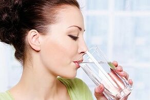 girl drinking water in a diet for lazy people